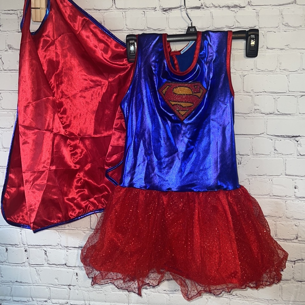 Kids supergirl dress with detached cape. Measures 23 inches from shoulder to hem